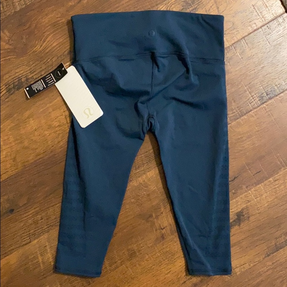 Lululemon Reveal teal crop leggings sz 10 NWT